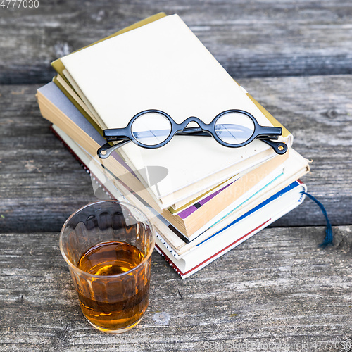 Image of books and reading glasses