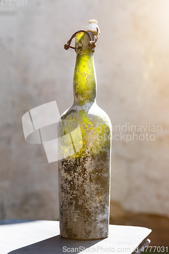 Image of dirty old wine bottle