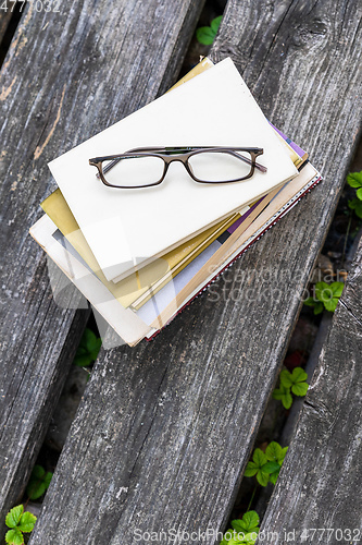Image of books and reading glasses
