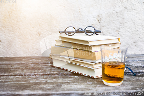 Image of books and reading glasses