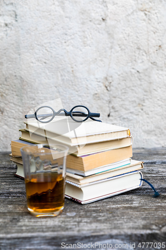 Image of books and reading glasses