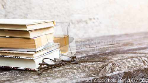 Image of books and reading glasses