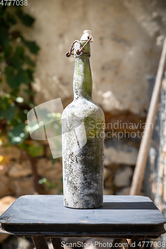 Image of dirty old wine bottle