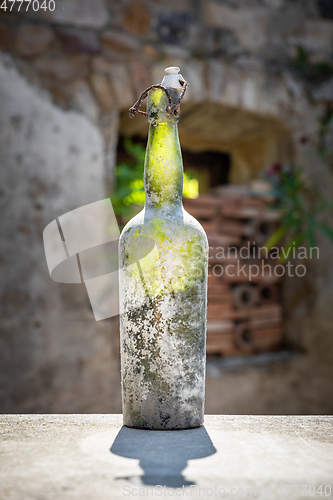 Image of dirty old wine bottle