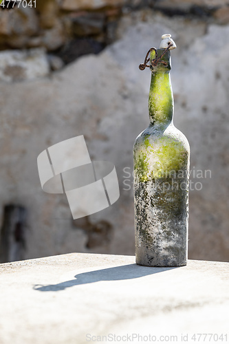 Image of dirty old wine bottle