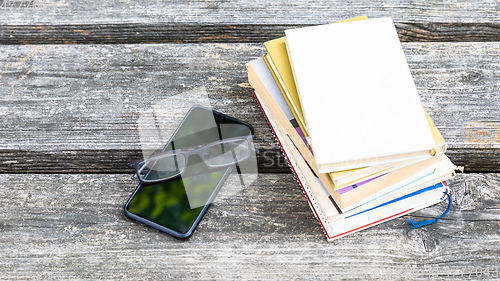 Image of books and reading glasses