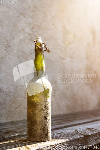 Image of dirty old wine bottle