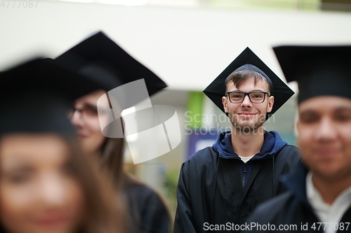 Image of Group of diverse international graduating students celebrating