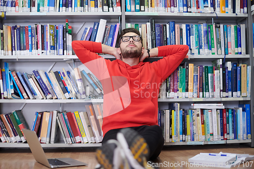 Image of the students uses a notebook, laptop and a school library