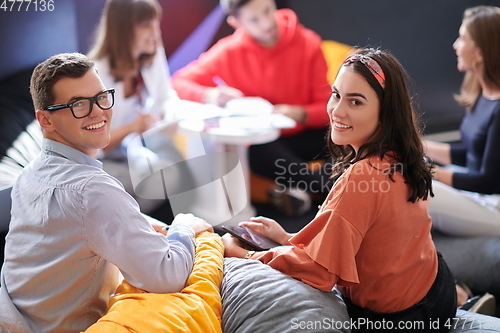 Image of students using modern technology for school project