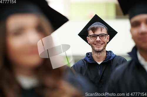 Image of Group of diverse international graduating students celebrating