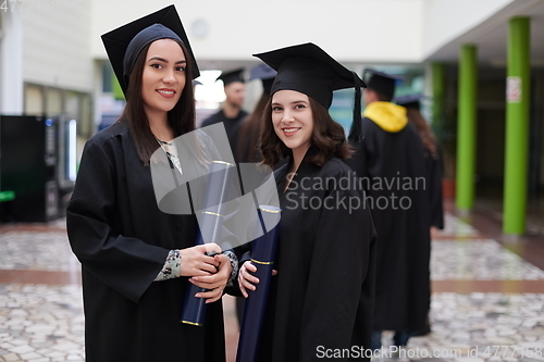 Image of Group of diverse international graduating students celebrating