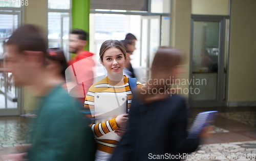 Image of famel student with modern technology in school