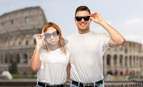 Image of happy couple in sunglasses over coliseum