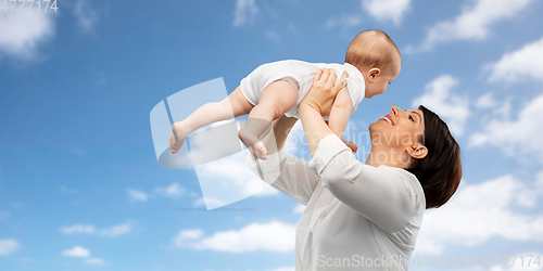 Image of happy middle-aged mother with little baby daughter