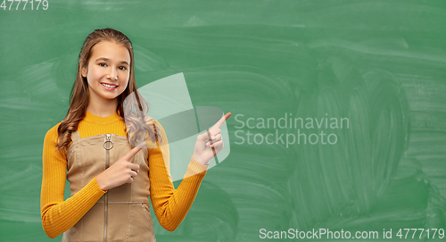 Image of teenage student girl pointing fingers up