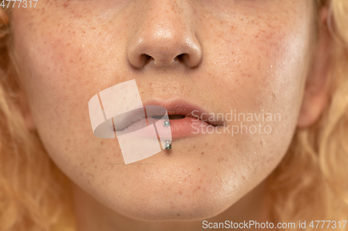 Image of Beautiful young woman\'s full lips close-up, perfect skincare concept