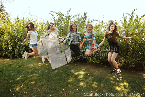 Image of Happy women outdoors on sunny day. Girl power concept.