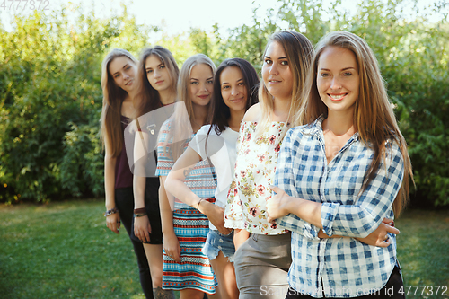 Image of Happy women outdoors on sunny day. Girl power concept.