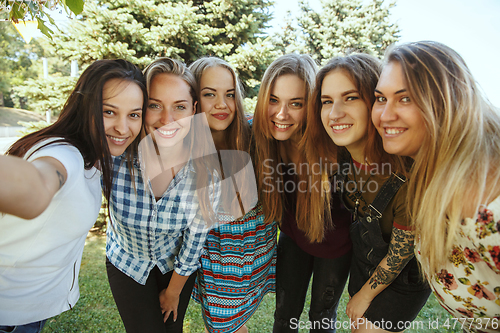 Image of Happy women outdoors on sunny day. Girl power concept.