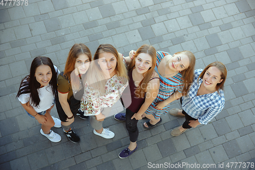 Image of Happy women outdoors on sunny day. Girl power concept.