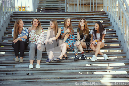 Image of Happy women outdoors on sunny day. Girl power concept.