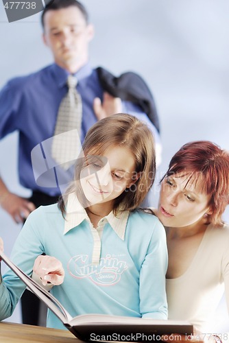 Image of A family with a book