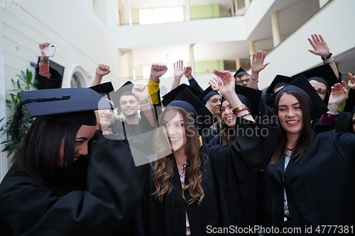 Image of Group of diverse international graduating students celebrating