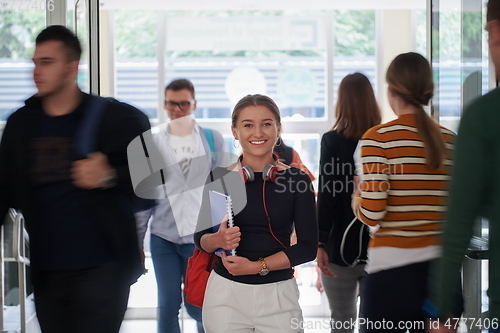 Image of famel student with modern technology in school