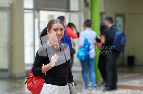 Image of famel student with modern technology in school