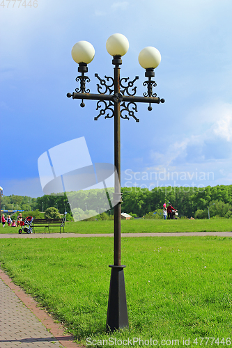 Image of beautiful white round lanterns in city park