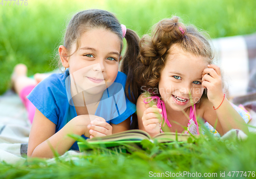 Image of Two little girls are reading book