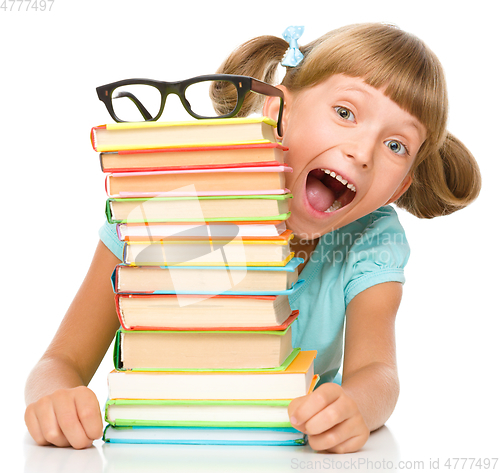 Image of Little girl with books