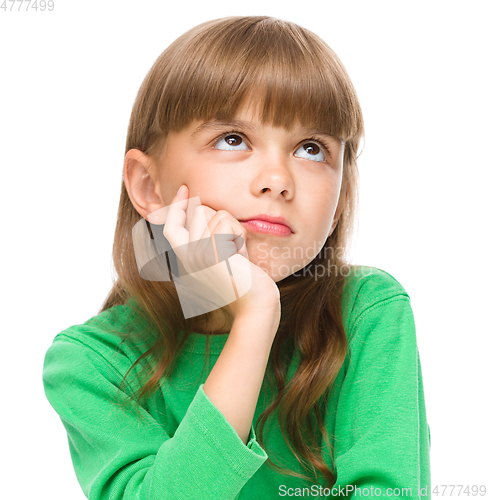 Image of Young girl is daydreaming