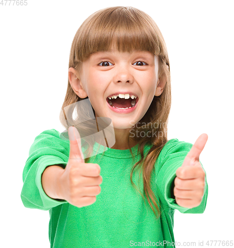 Image of Little girl is showing thumb up sign