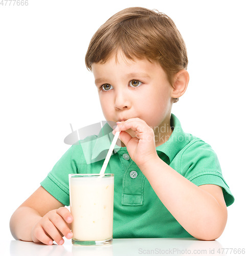 Image of Cute little boy with a glass of milk