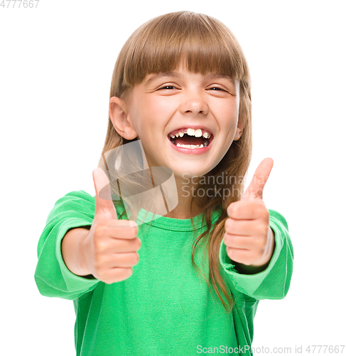 Image of Little girl is showing thumb up sign