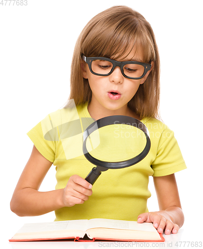 Image of Little girl is reading book