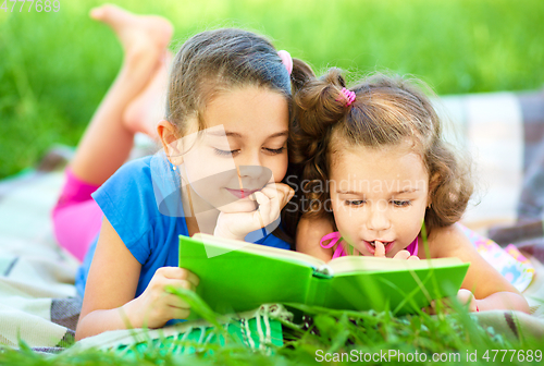 Image of Two little girls are reading book