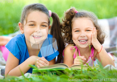 Image of Two little girls are reading book
