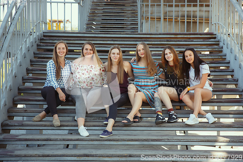 Image of Happy women outdoors on sunny day. Girl power concept.