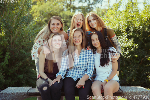 Image of Happy women outdoors on sunny day. Girl power concept.