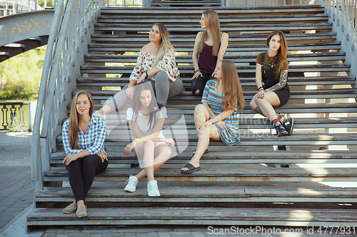 Image of Happy women outdoors on sunny day. Girl power concept.