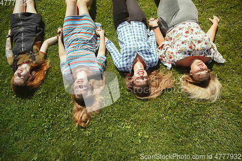 Image of Happy women outdoors on sunny day. Girl power concept.
