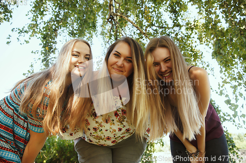 Image of Happy women outdoors on sunny day. Girl power concept.