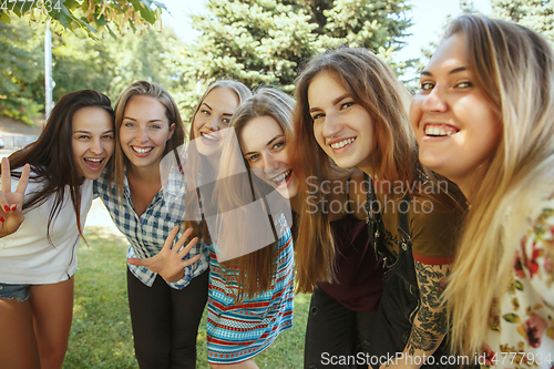 Image of Happy women outdoors on sunny day. Girl power concept.