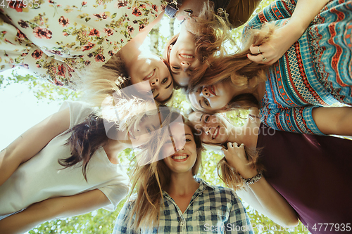 Image of Happy women outdoors on sunny day. Girl power concept.