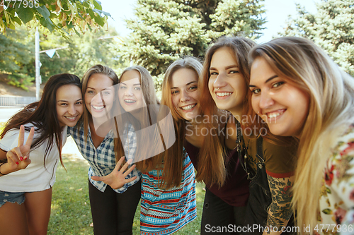 Image of Happy women outdoors on sunny day. Girl power concept.