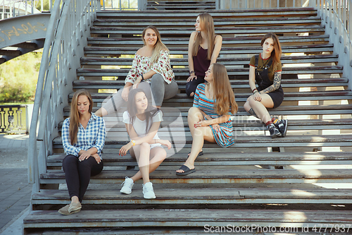 Image of Happy women outdoors on sunny day. Girl power concept.