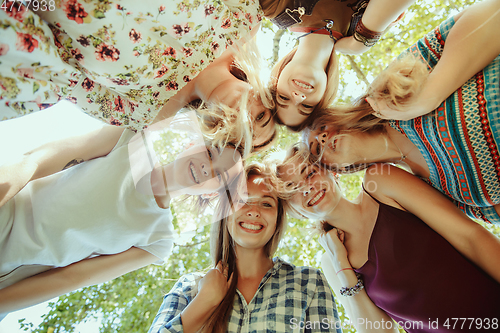 Image of Happy women outdoors on sunny day. Girl power concept.